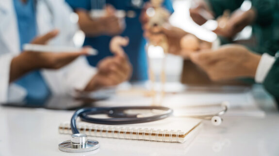 Close up of a stethoscope and digital tablet with virtual electronic medical record of patient on interface.Digital healthcare and network on modern virtual screen, DNA medical technology.