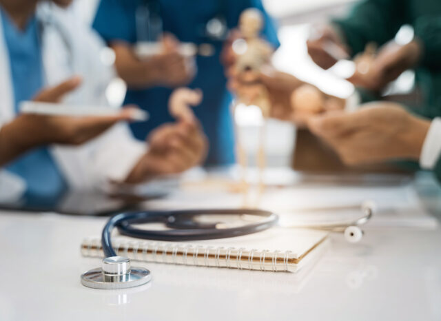 Close up of a stethoscope and digital tablet with virtual electronic medical record of patient on interface.Digital healthcare and network on modern virtual screen, DNA medical technology.